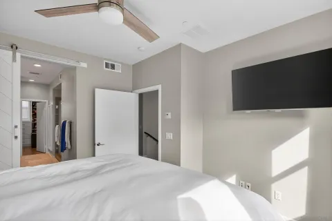 a spacious bathroom with a sink a mirror a vanity and shower