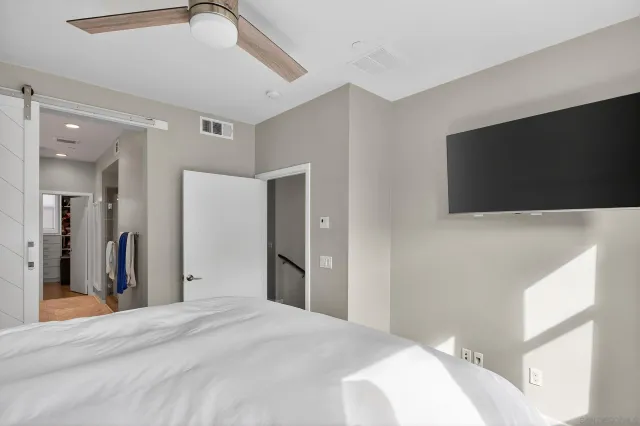 a spacious bathroom with a sink a mirror a vanity and shower