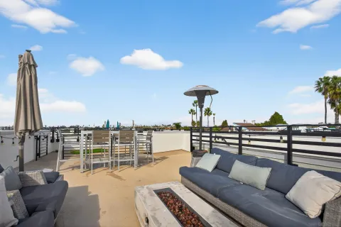 a view of roof deck with seating space and barbeque oven