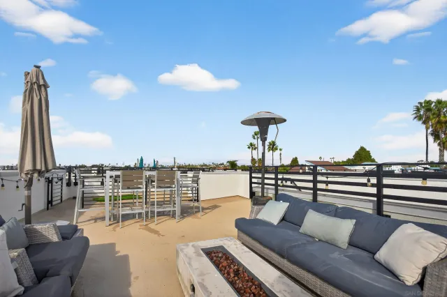 a view of roof deck with seating space and barbeque oven