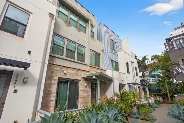 a view of a patio with chairs and tables
