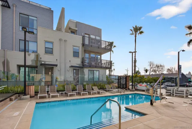 a view of a swimming pool with a lounge chairs