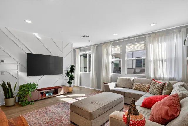 a living room with furniture and a large window