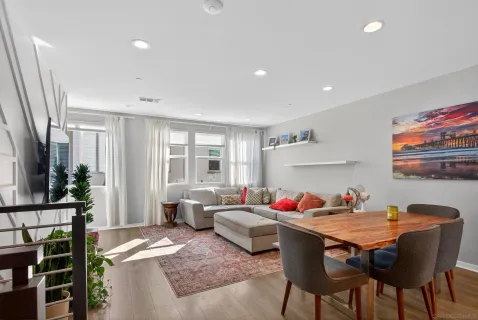 a dining room with furniture and window
