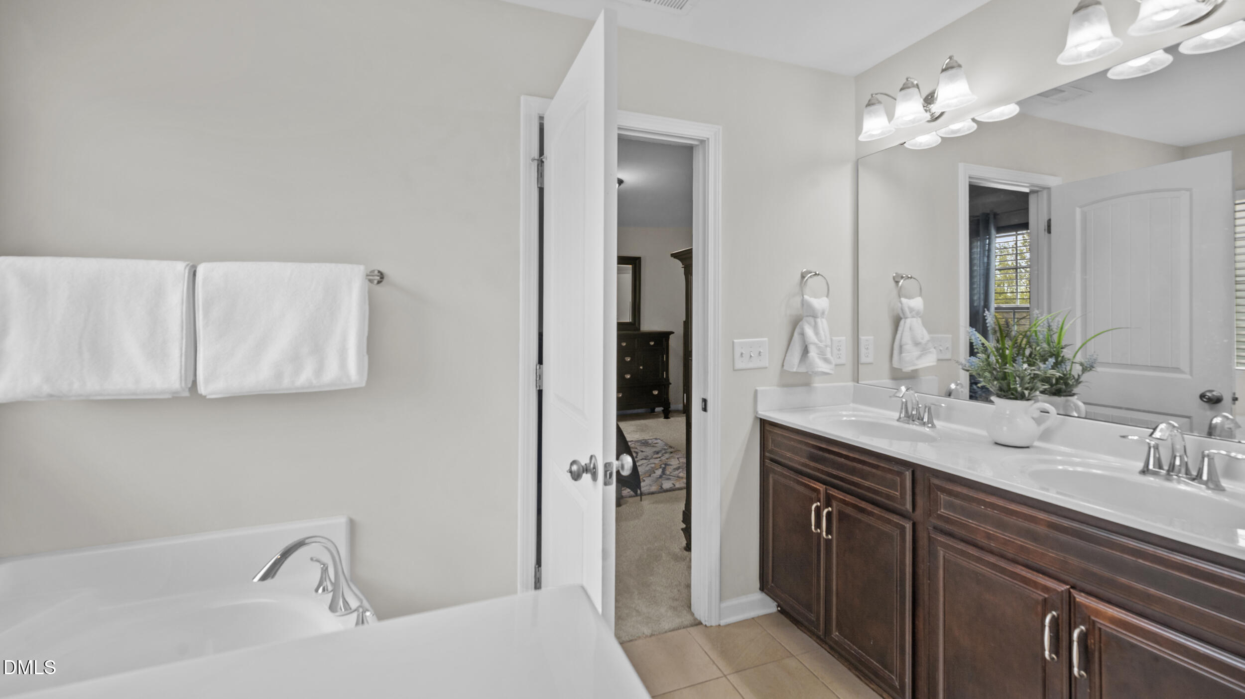 2050 Sinclair Burlington, NC 27215 - Photo 15 of 17 a bathroom with a tub sink and mirror
