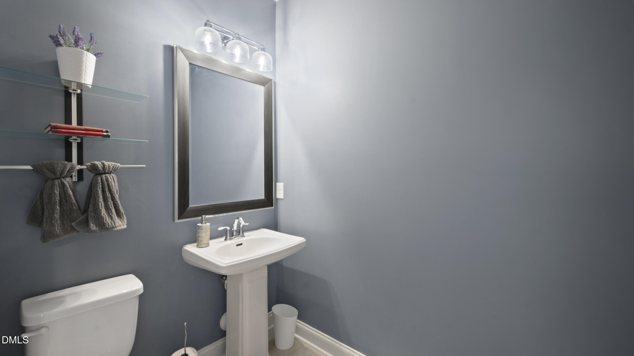 2050 Sinclair Burlington, NC 27215 - Photo 5 of 17 a bathroom with a toilet sink and mirror