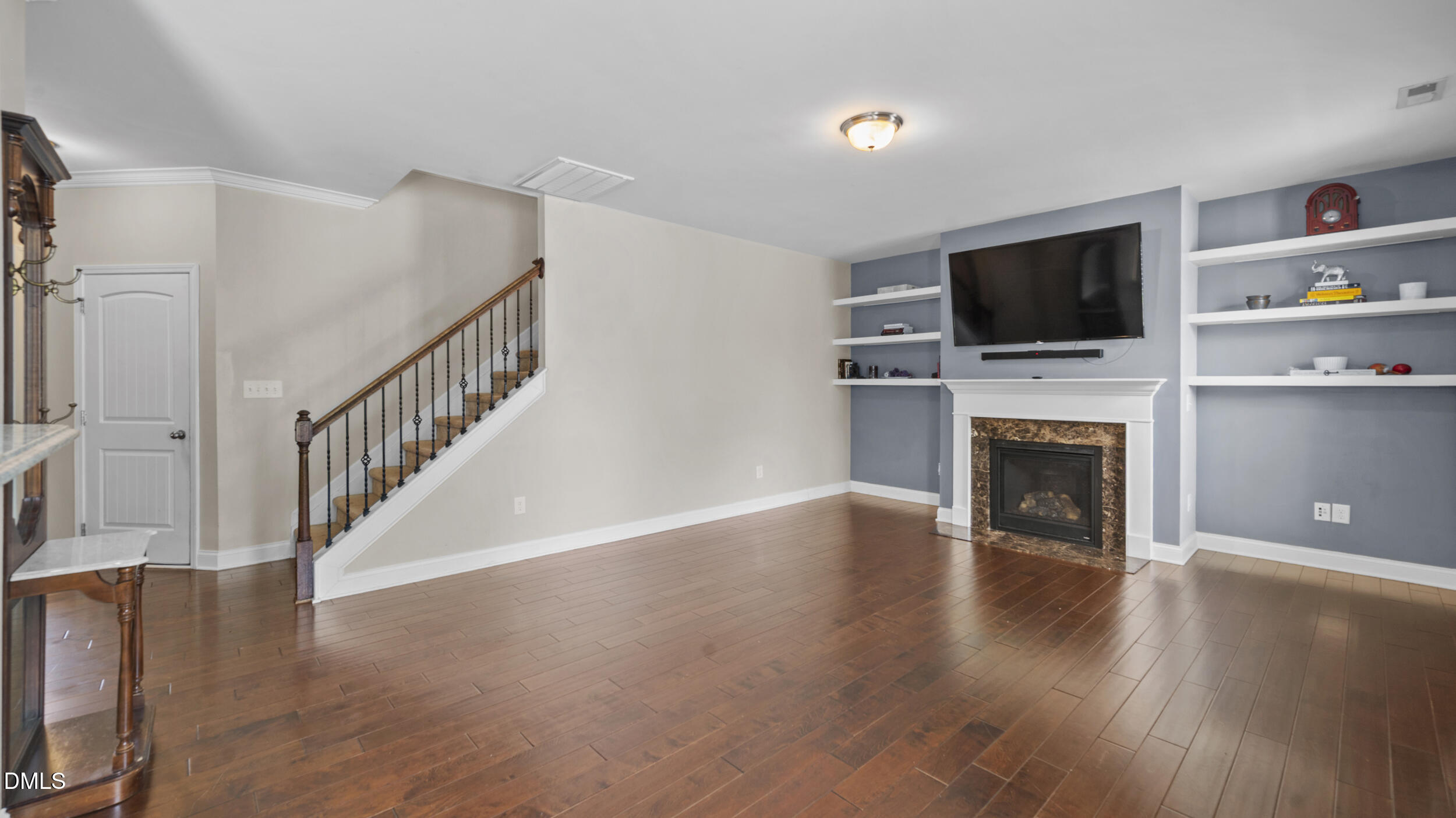 2050 Sinclair Burlington, NC 27215 - Photo 8 of 17 a view of a livingroom with wooden floor and a fireplace