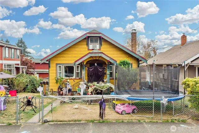 a front view of a house with swimming pool and a fountain