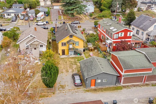an aerial view of residential houses and car parked on street side