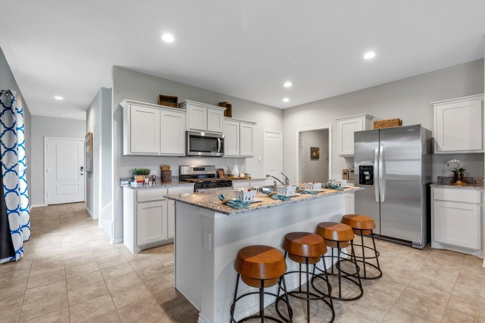168 Mojave Road Boyd, TX 76023 - Photo 35 of 37 a kitchen with refrigerator and chairs