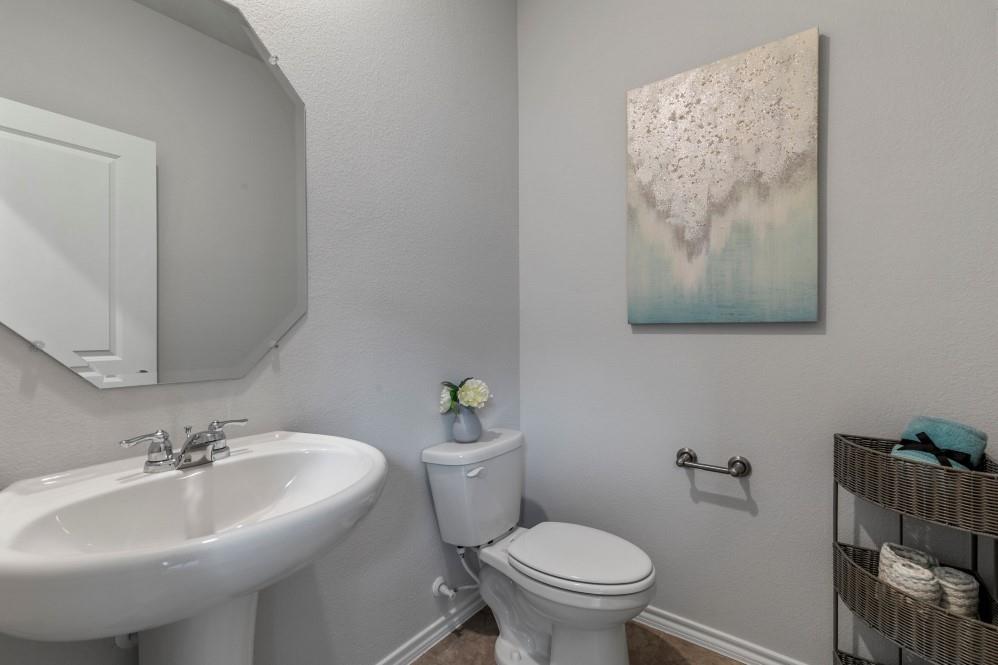 168 Mojave Road Boyd, TX 76023 - Photo 30 of 37 a bathroom with a sink mirror and toilet