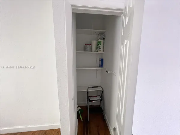 a view of a hallway with closet