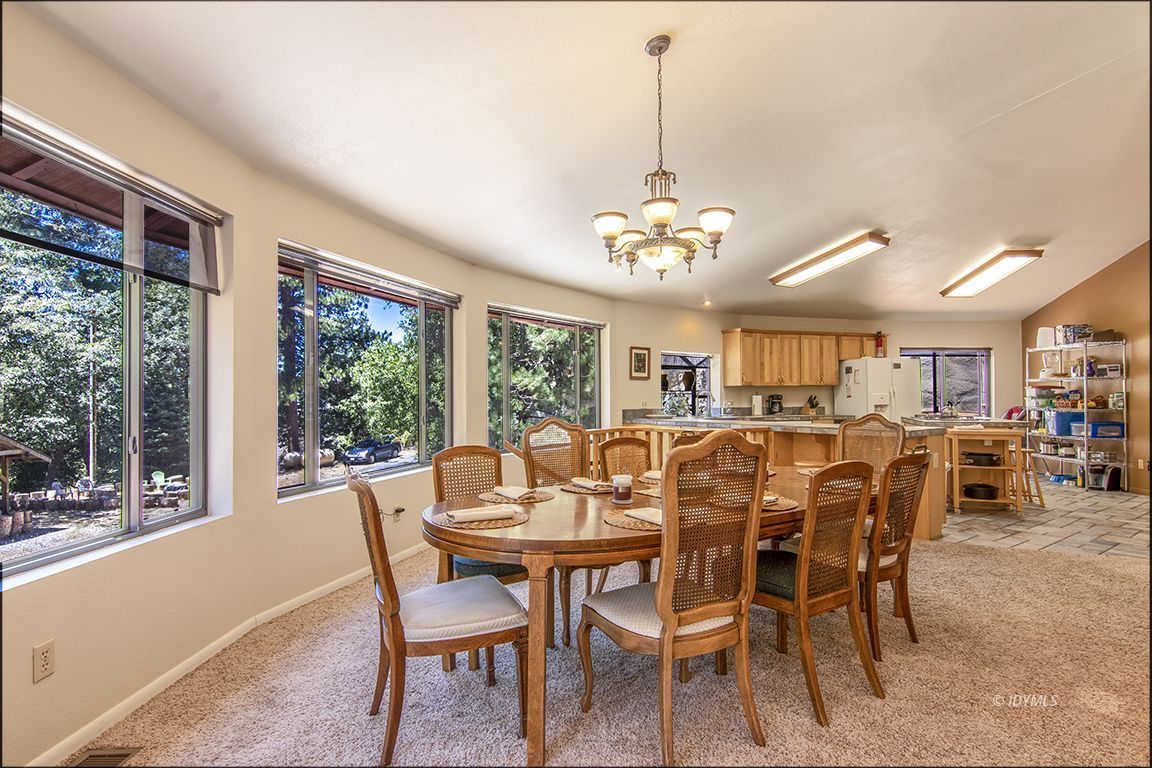 24625 Baldy Road Idyllwild, CA 92549 - Photo 14 of 80 a view of a dining room with furniture window and outside view