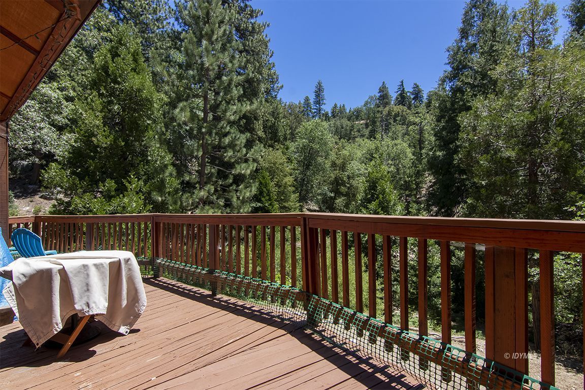 24625 Baldy Road Idyllwild, CA 92549 - Photo 17 of 80 a balcony with wooden floor and outdoor space