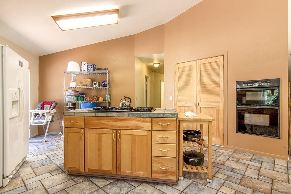 24625 Baldy Road Idyllwild, CA 92549 - Photo 27 of 80 a kitchen with stainless steel appliances a sink and cabinets