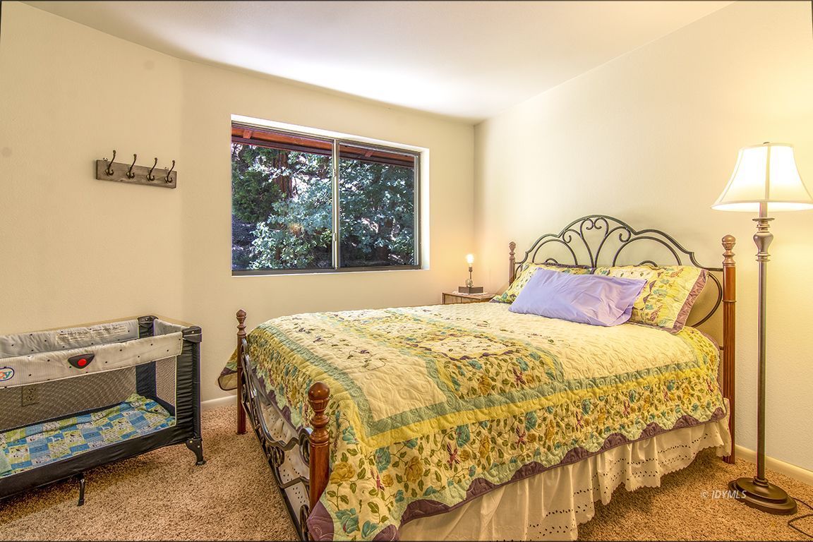 24625 Baldy Road Idyllwild, CA 92549 - Photo 32 of 80 a bedroom with a bed and a window