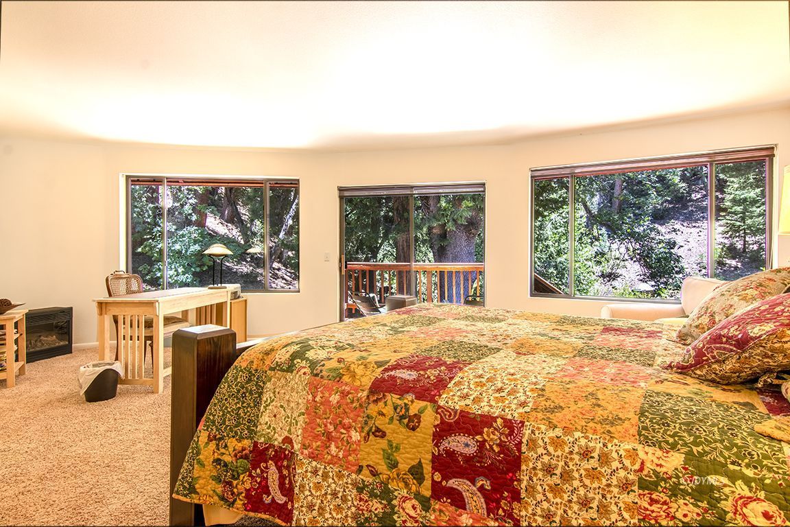 24625 Baldy Road Idyllwild, CA 92549 - Photo 36 of 80 a bedroom with a bed and a large window