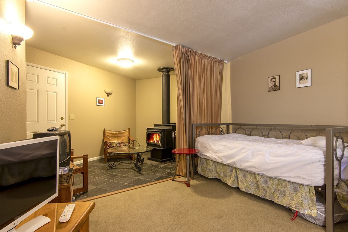 24625 Baldy Road Idyllwild, CA 92549 - Photo 52 of 80 a bedroom with a bed and wooden floor