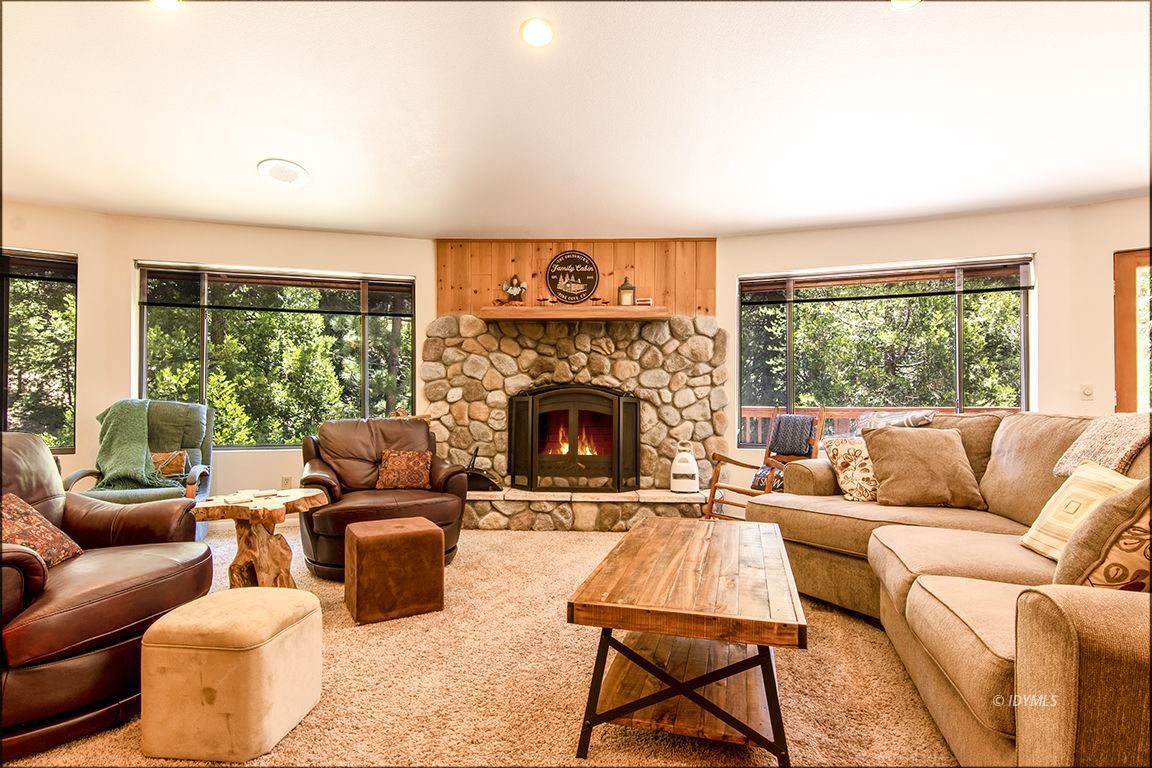 24625 Baldy Road Idyllwild, CA 92549 - Photo 9 of 80 a living room with furniture a large window and a fireplace