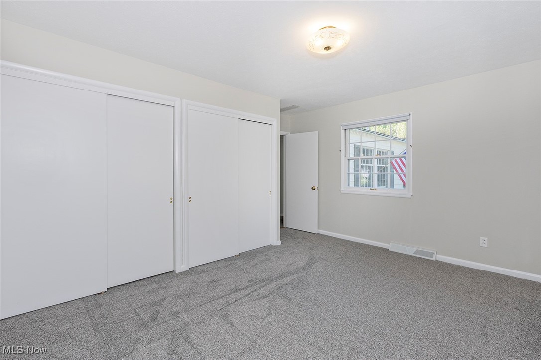 1691 Harwich Road Lyndhurst, OH 44124 - Photo 20 of 45 Bedroom with multiple closets and carpet flooring