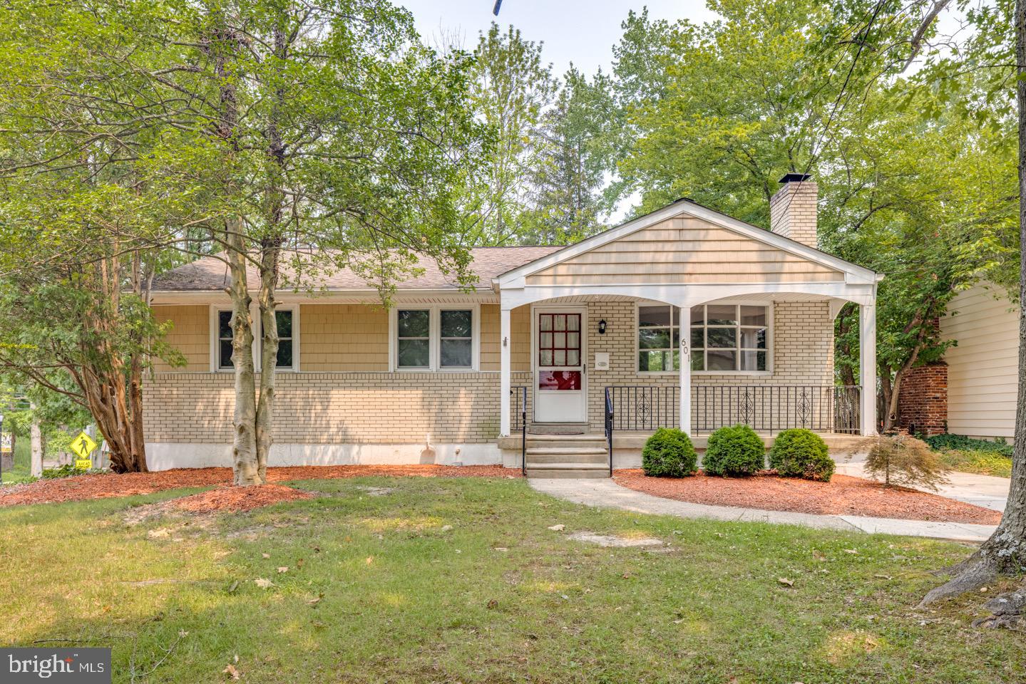 a front view of a house with a porch