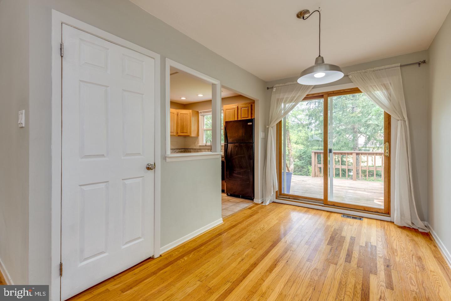 601 Pardee Lane Haddonfield, NJ 08033 - Photo 15 of 37 a view of an empty room with a window and wooden floor