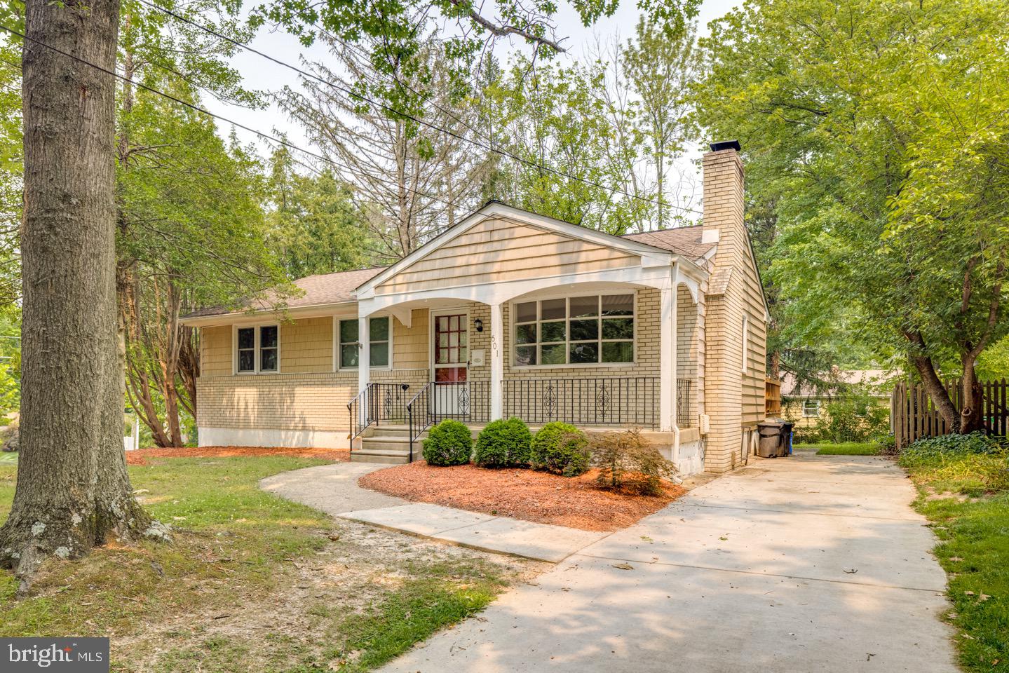 601 Pardee Lane Haddonfield, NJ 08033 - Photo 2 of 37 a front view of a house with a yard