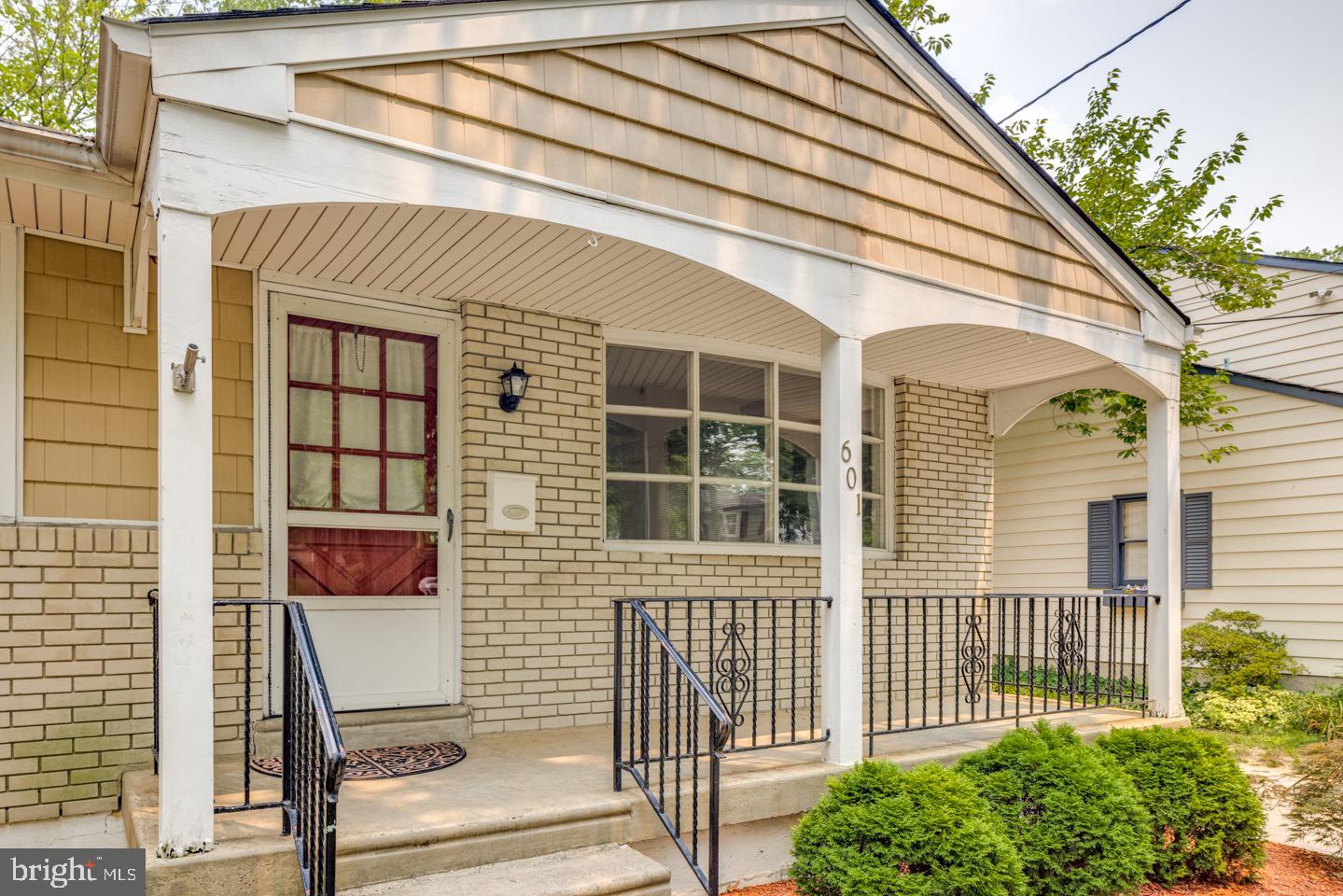 601 Pardee Lane Haddonfield, NJ 08033 - Photo 4 of 37 a front view of a house with a porch