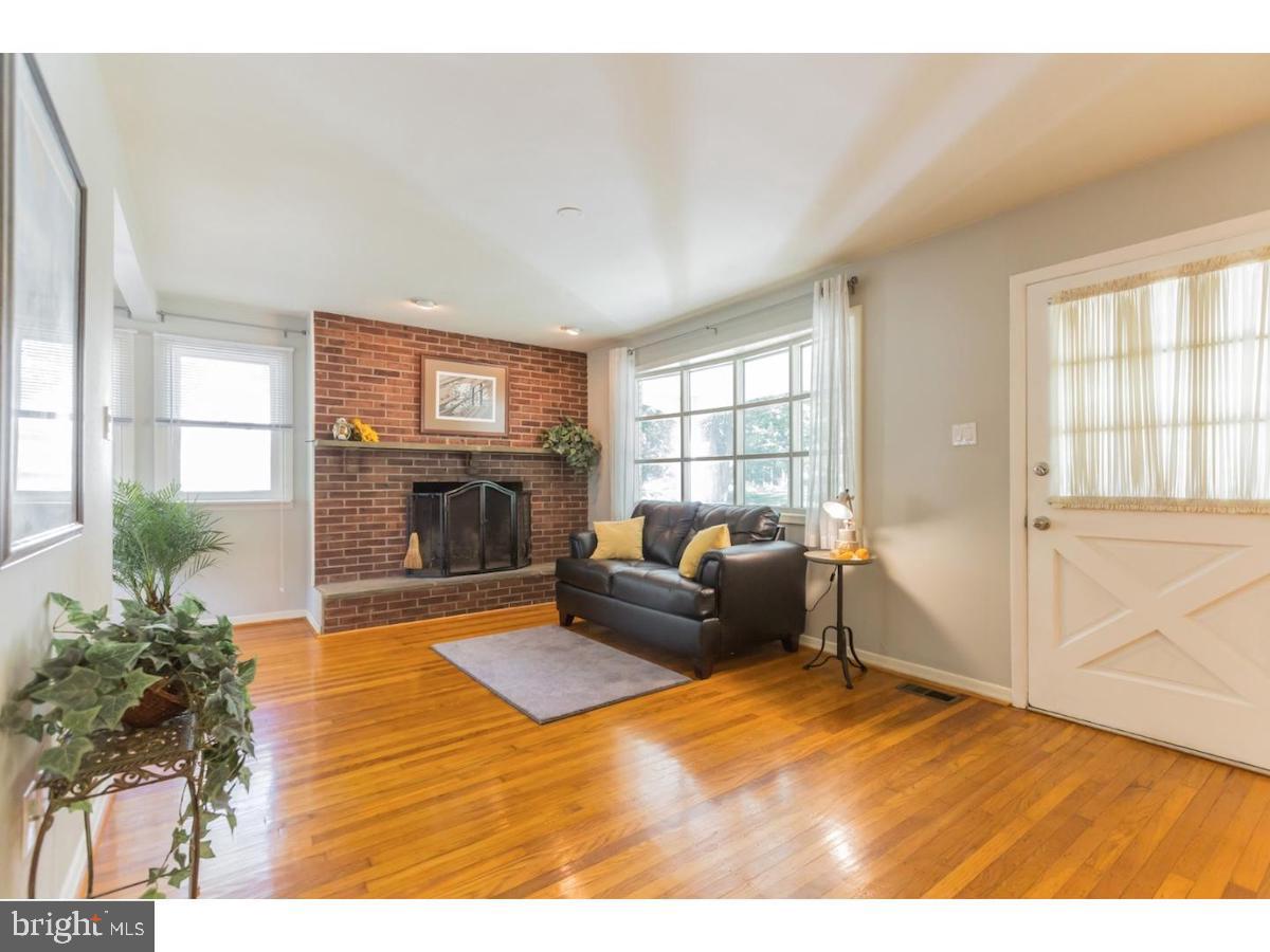 601 Pardee Lane Haddonfield, NJ 08033 - Photo 5 of 37 a living room with furniture and a fireplace