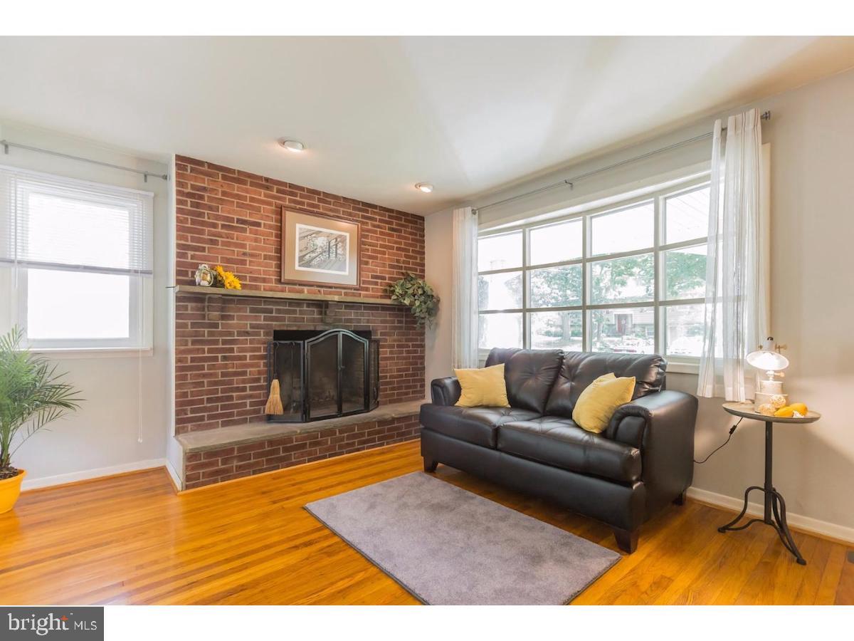 601 Pardee Lane Haddonfield, NJ 08033 - Photo 6 of 37 a living room with furniture and a fireplace