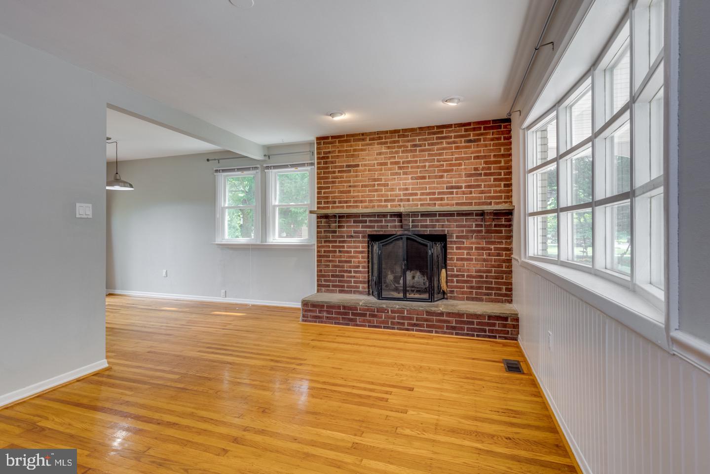 601 Pardee Lane Haddonfield, NJ 08033 - Photo 7 of 37 a view of an empty room with wooden floor and a window