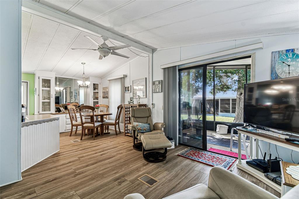 12501 Ulmerton Road, Unit 71 Largo, FL 33774 - Photo 20 of 75 a living room with furniture and a flat screen tv