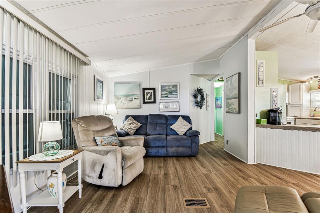 12501 Ulmerton Road, Unit 71 Largo, FL 33774 - Photo 21 of 75 a living room with furniture and a large window