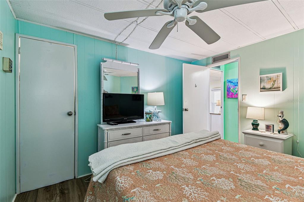 12501 Ulmerton Road, Unit 71 Largo, FL 33774 - Photo 22 of 75 a bedroom with a bed and a flat screen tv