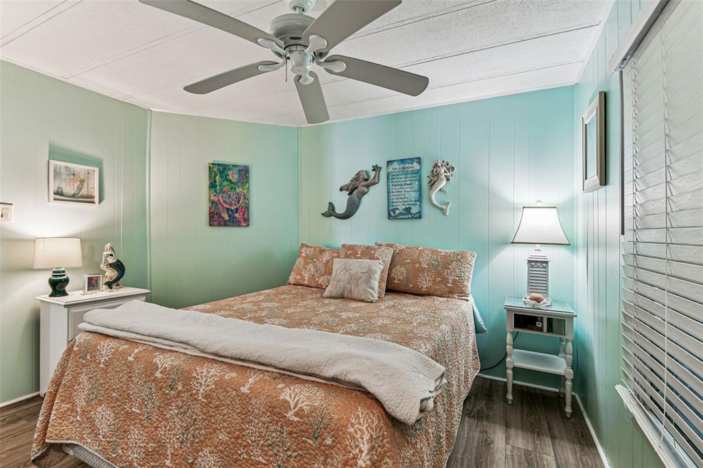 12501 Ulmerton Road, Unit 71 Largo, FL 33774 - Photo 24 of 75 a bedroom with a bed and a table in it