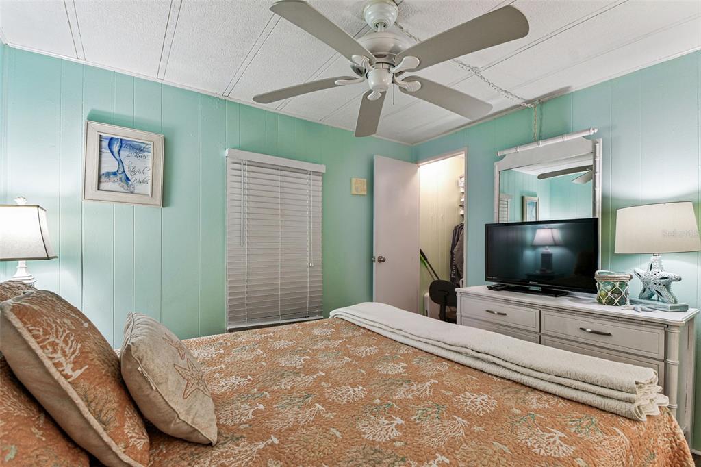 12501 Ulmerton Road, Unit 71 Largo, FL 33774 - Photo 25 of 75 a bedroom with a bed and a flat screen tv