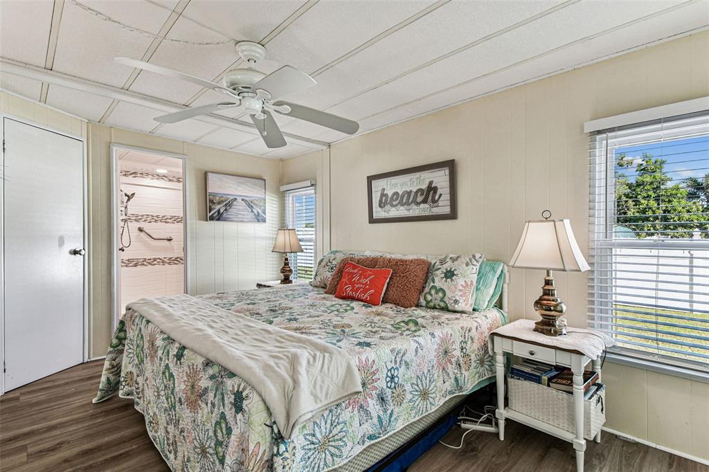 12501 Ulmerton Road, Unit 71 Largo, FL 33774 - Photo 33 of 75 a bedroom with a bed and a chandelier