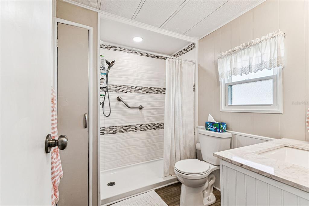 12501 Ulmerton Road, Unit 71 Largo, FL 33774 - Photo 37 of 75 a bathroom with a sink toilet and shower