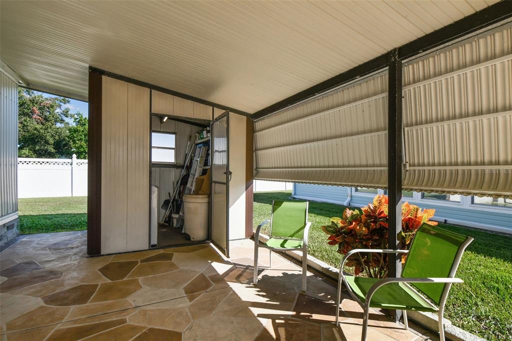12501 Ulmerton Road, Unit 71 Largo, FL 33774 - Photo 42 of 75 a building outdoor space with patio furniture and potted plants