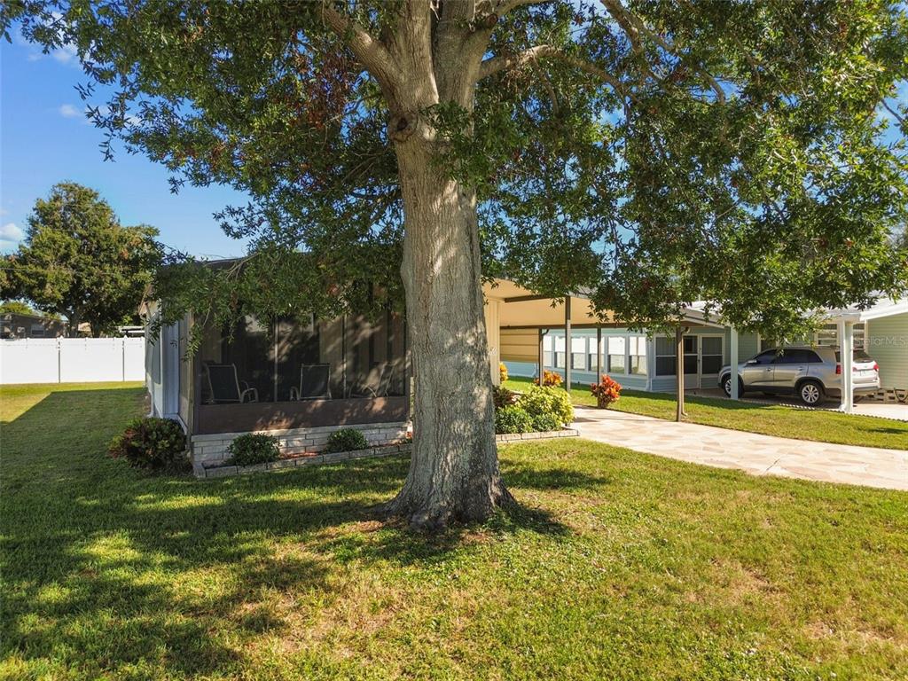 12501 Ulmerton Road, Unit 71 Largo, FL 33774 - Photo 45 of 75 a view of a house with swimming pool and sitting area