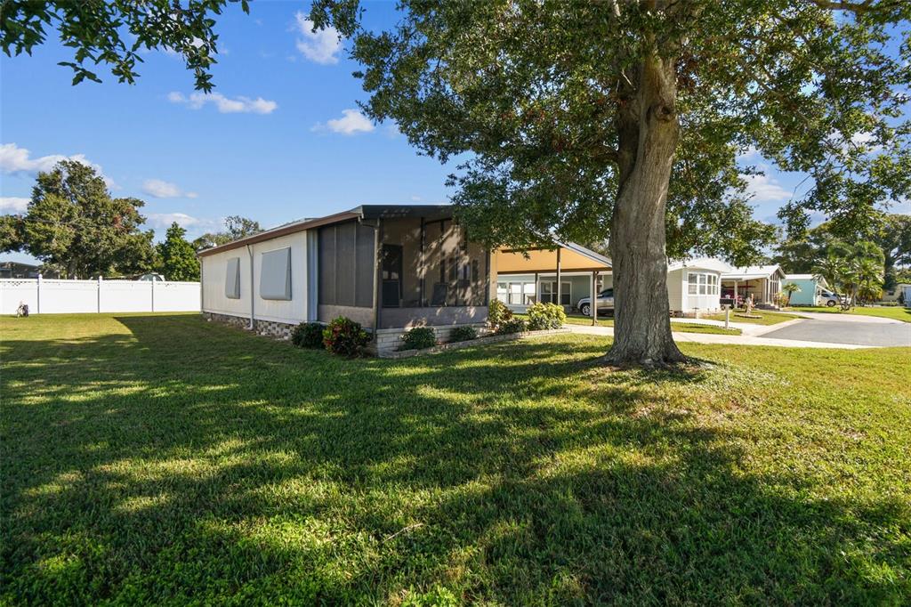 12501 Ulmerton Road, Unit 71 Largo, FL 33774 - Photo 48 of 75 a view of a house with a yard