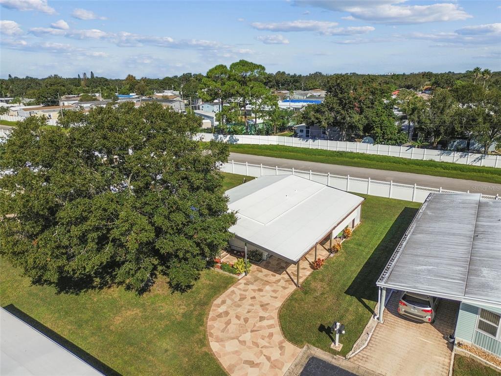 12501 Ulmerton Road, Unit 71 Largo, FL 33774 - Photo 54 of 75 a view of a swimming pool with an outdoor seating