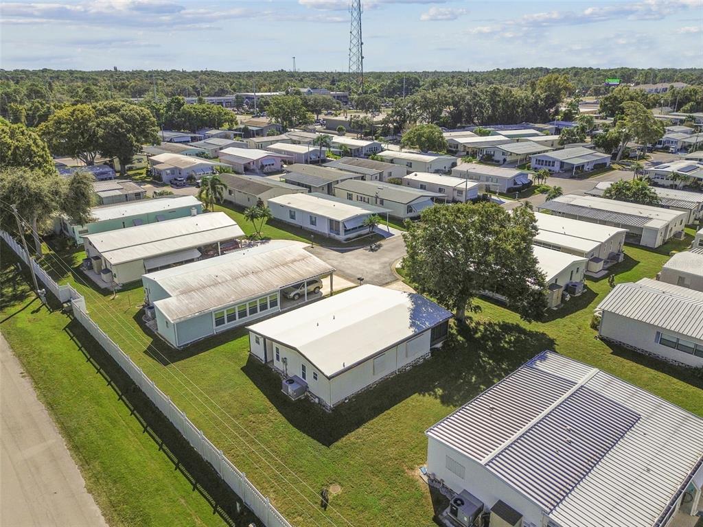 12501 Ulmerton Road, Unit 71 Largo, FL 33774 - Photo 60 of 75 an aerial view of a house with a garden and lake view