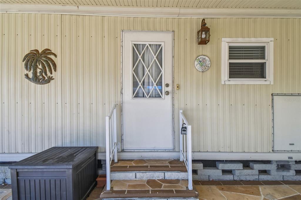 12501 Ulmerton Road, Unit 71 Largo, FL 33774 - Photo 7 of 75 a bathroom with a granite countertop sink and a mirror