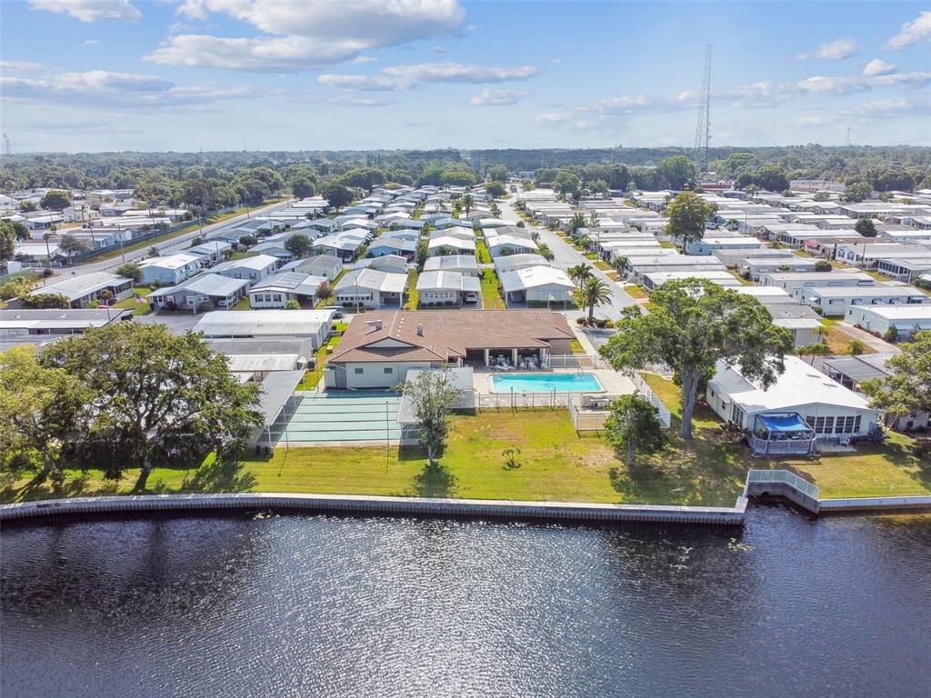 12501 Ulmerton Road, Unit 71 Largo, FL 33774 - Photo 73 of 75 an aerial view of a swimming pool with an outdoor space and seating area