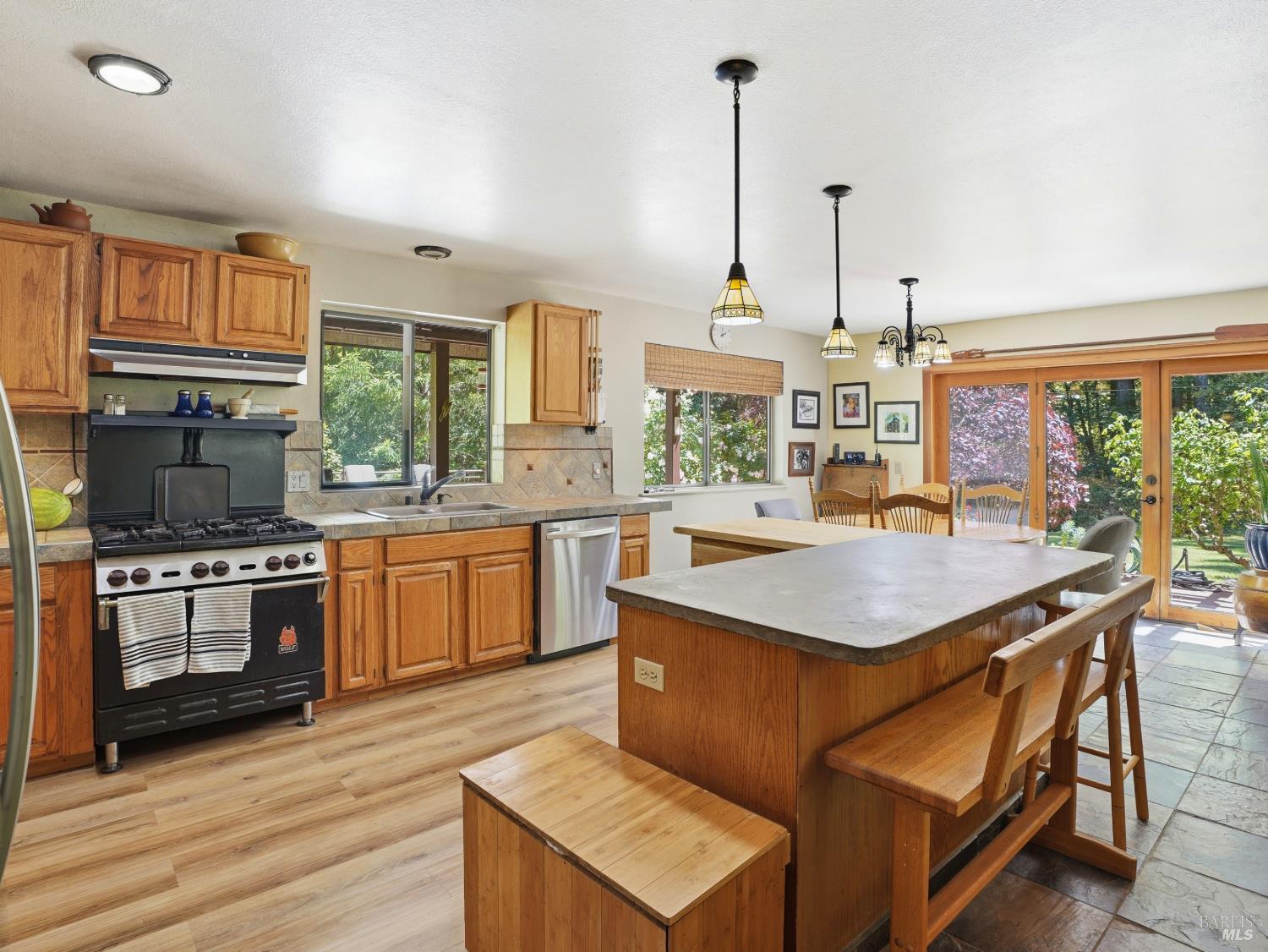 31397 Seaview Road Cazadero, CA 95421 - Photo 13 of 47 a kitchen with a stove a sink and a refrigerator