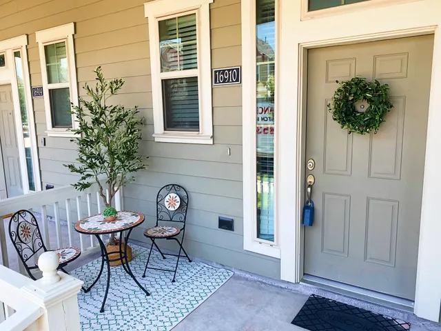 a view of a entryway of a house with table and chairs