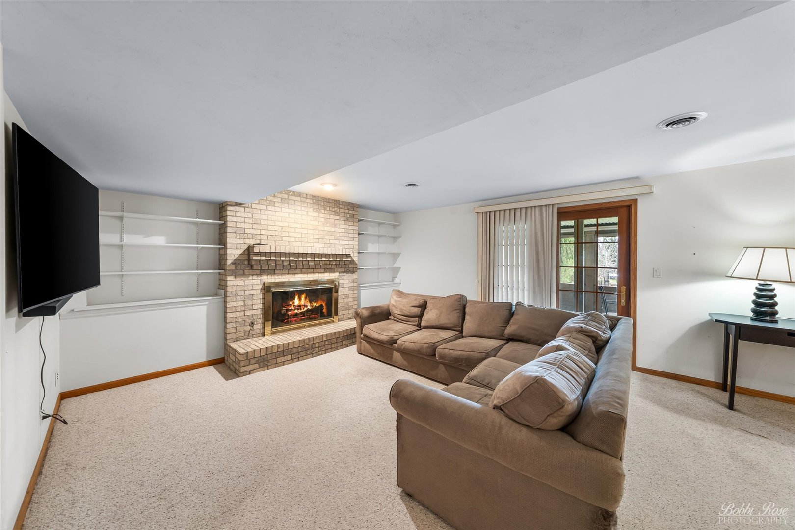 1303 Westley Lane West Dundee, IL 60118 - Photo 33 of 61 a living room with furniture and a fireplace