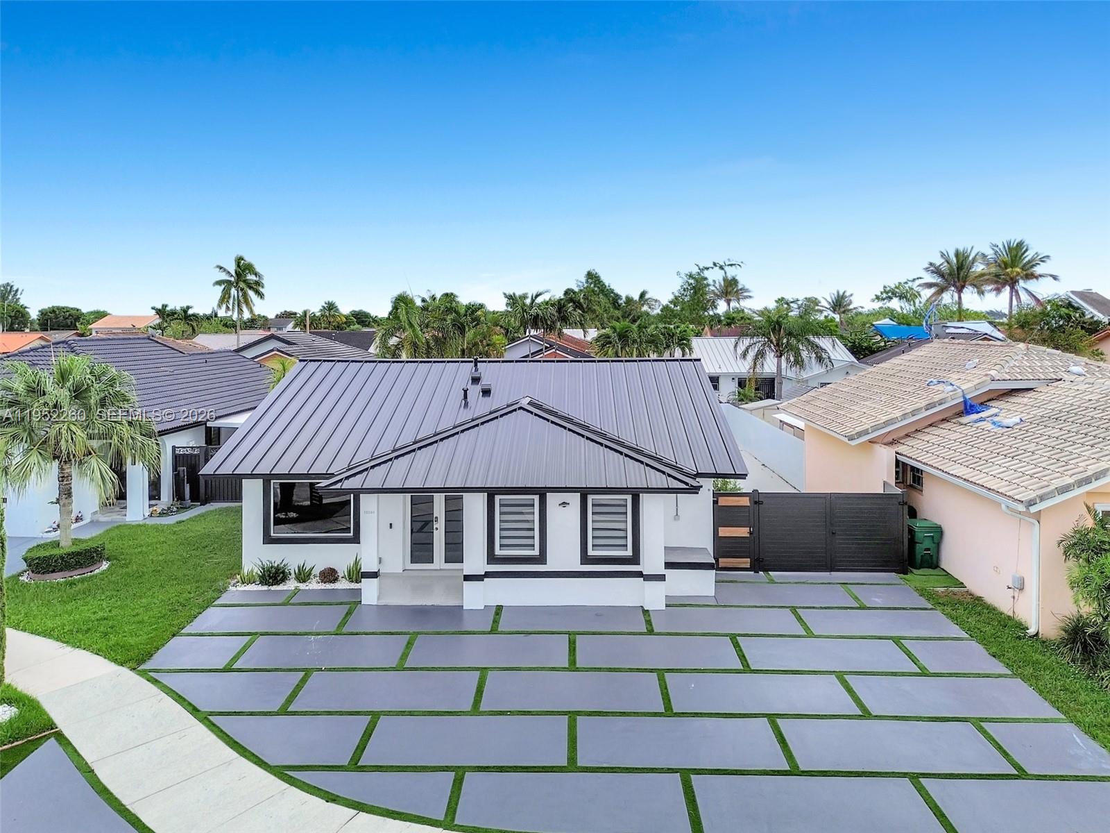 a aerial view of a house with a yard