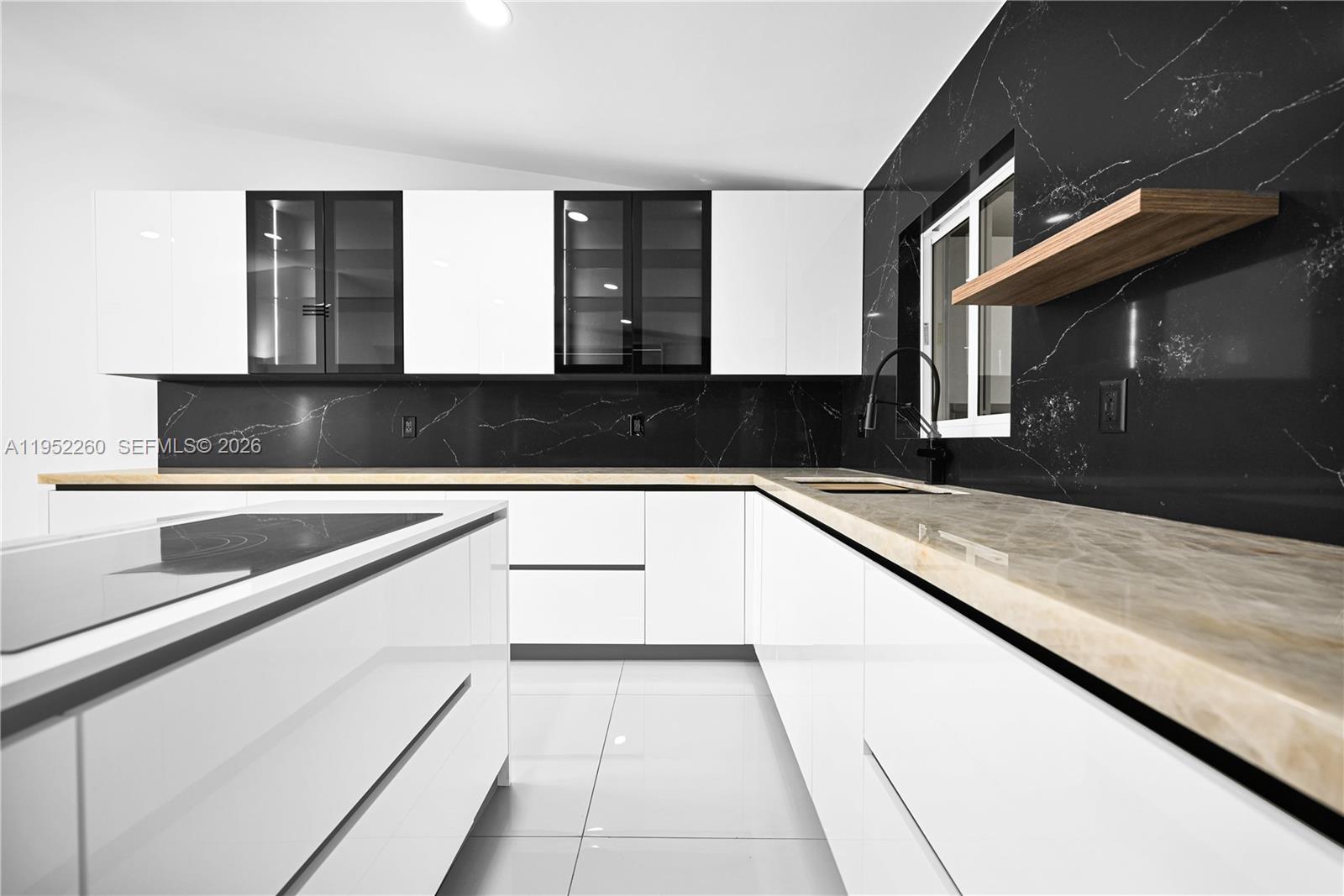 13284 Southwest 39th Street Miami, FL 33175 - Photo 16 of 67 a kitchen with stainless steel appliances granite countertop a sink and a stove